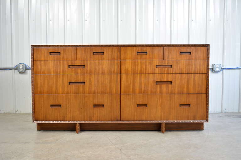 A dresser designed by Frank Lloyd Wright for Henredon.  Striking mahogany grain.  Carved Taliesin edge.  Excellent condition.