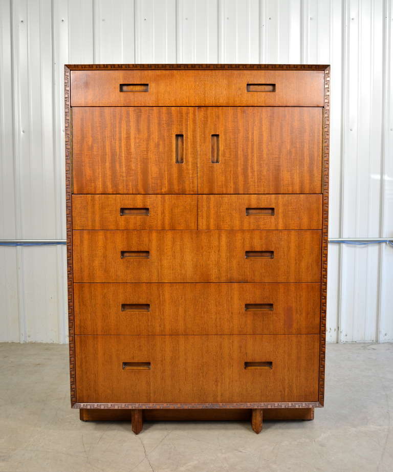 A tall mahogany dresser by Frank Lloyd Wright for Henredon.  Striking mahogany grain.  Carved Taliesin edge.  Excellent condition.