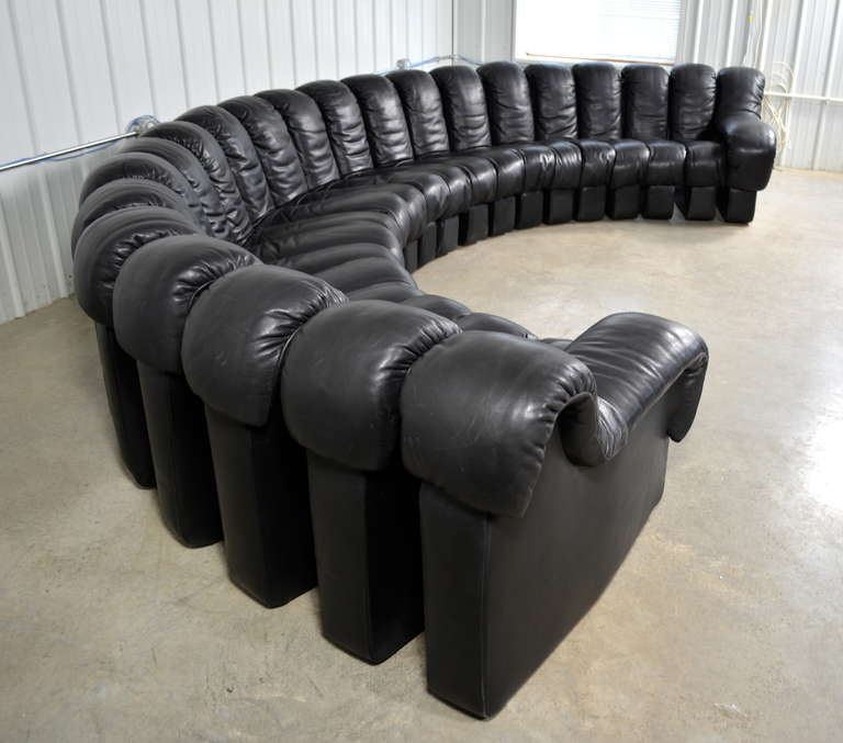 A De Sede DS600 Non-Stop modular sofa for Stendig.  Designed by Ueli Berger, Elenora Peduzzi-Riva and Heinz Ulrich.  It consists of 22 sections that can be connected and arranged in any shape.  Original black leather upholstery in excellent