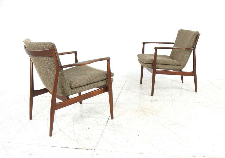 Pair of Finn Juhl Delegate chairs.  Originally designed for the Trusteeship Council Chamber at the United Nations.  Elegant sculptural details and fine craftsmanship define these chairs.