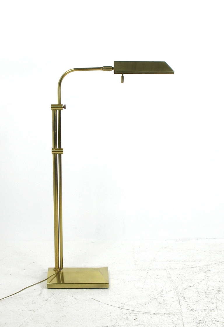 An adjustable brass pharmacy lamp by Chapman.  Height adjustable from 36