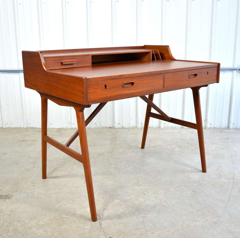 Danish teak desk by Arne Wahl Iversen for Vinde Mobelfabrik.  Newly refinished.  Plenty of storage.  Great size and beautiful form.