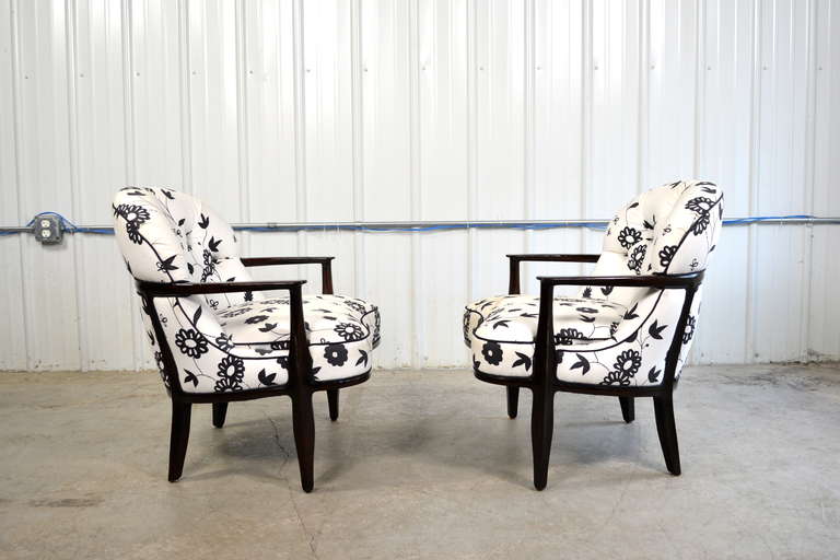 A pair of Janus lounge chairs by Edward Wormley for Dunbar.  The exposed mahogany frames have an ebonized finish.  The upholstery is not original and will need to be replaced.