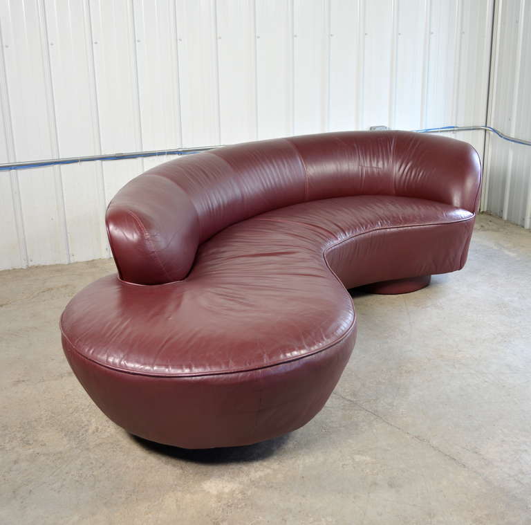 A pair of serpentine sofas designed by Vladimir Kagan for Directional.  Both are labeled.  Original leather upholstery.