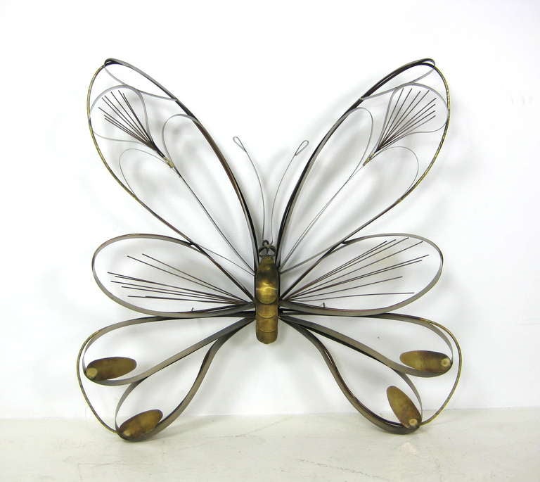 A large brass butterfly sculpture produced by Curtis Jere.  Labeled 