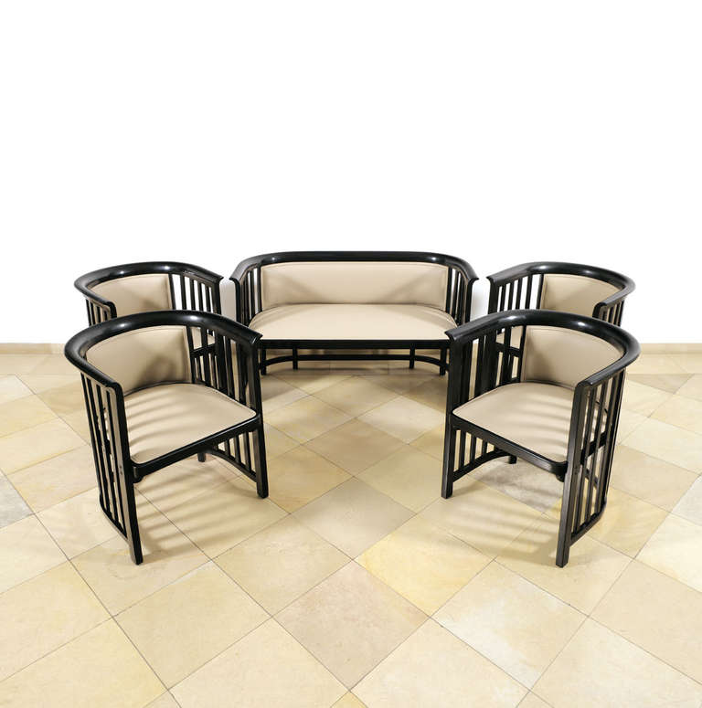 Bench and four Armchairsn design 1908
Manufactured by Jacob & Josef Kohn, Vienna, no 423/C (bench) and no 423/F (armchair)
Beech, stained black and polished, new leather upholstery
1 bench: H 76.5 cm, SH 48 cm, W 121.3 cm, D 57 cm
4 armchairs: H