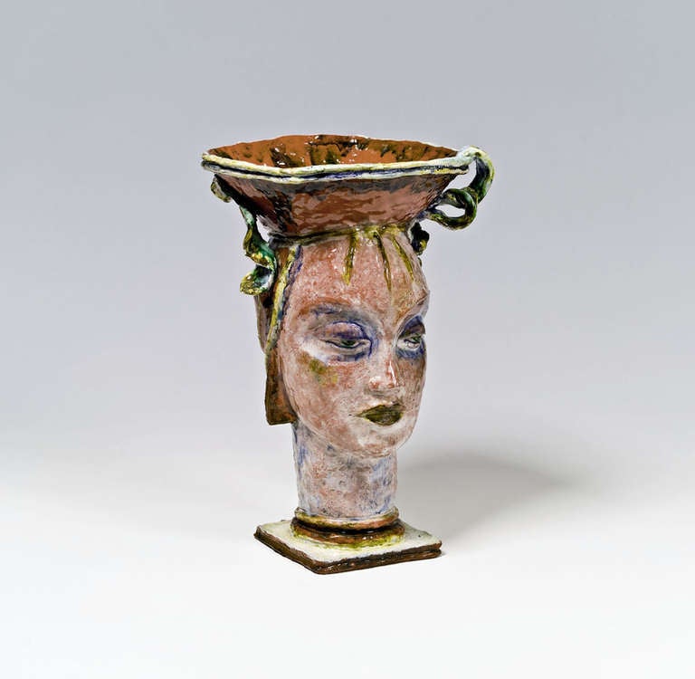 Head with Bowl, 1926
Original ceramic, unique piece
Manufactured by the Wiener Werkstätte, model number KO 5754
Red pottery, polychrome glaze
Signed G. Baudisch
Designated: Made in Austria
Two minor chips to the edge of the base
H 37.3