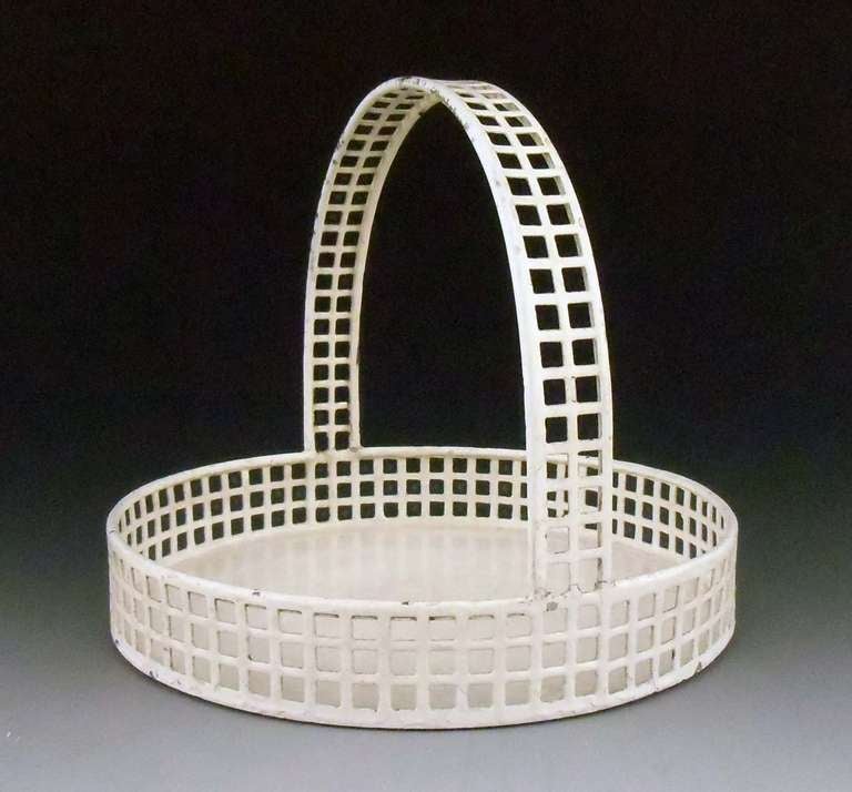 Latticed, round basket, manufactured by the Wiener Werkstätte
Galvanized tin, punched square pattern, painted white