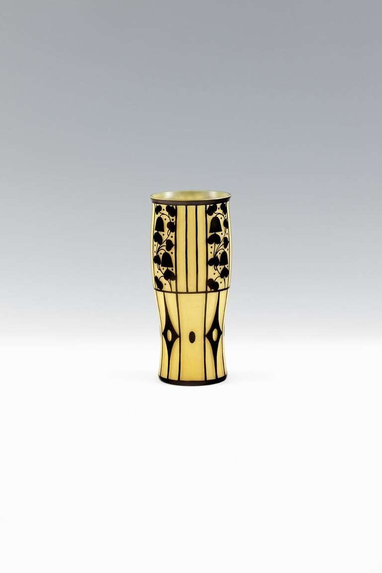 Yellow vase, manufactured by Johann Lötz Witwe, Klostermühle, series II, prod. no. 8128
Topas glass  (yellow)
Rubin (black covering)
Design 1911/12
Colourless glass, yellow interior, exterior covering in black brown, circling etched decor,