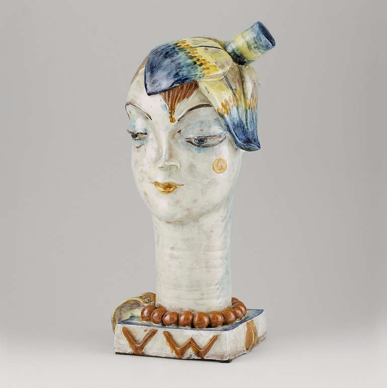 Head with Flower, manufactured by the Wiener Werkstätte, model number 527, dated 1928
Red pottery, polychrome glaze
Monogrammed on the base VW WW
Marks: WW, MADE IN AUSTRIA, monogram VW, 527, 7
Hörmann WV-K 605
Crack on the base was