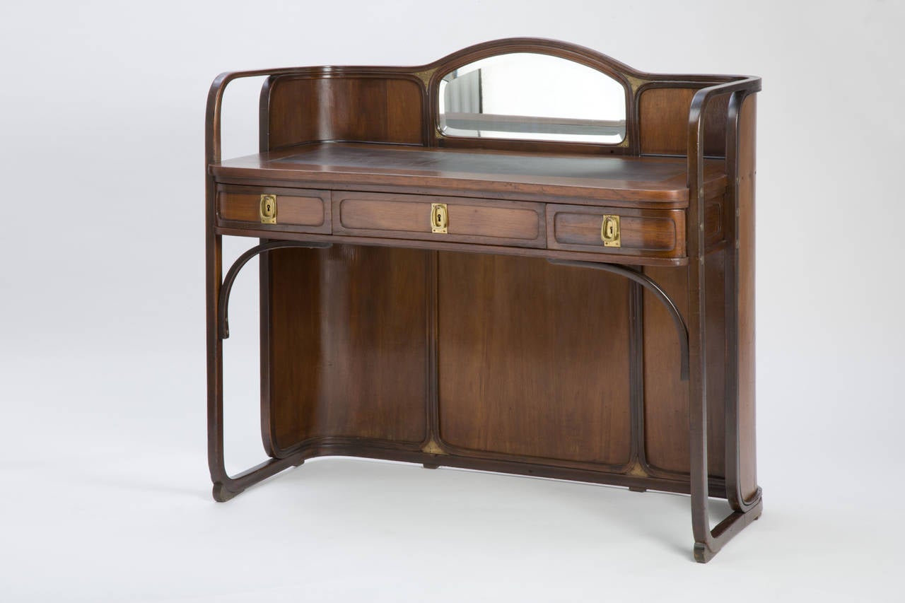 Desk, design 1902
Manufactured by Jacob & Josef Kohn, Vienna, model number 3134
Beech wood, stained and polished, brass fittings, cut and facetted mirror, writing inlay
H 105.5 cm, W 113.5 cm, D 54.5 cm
Exhibition: This model was first presented