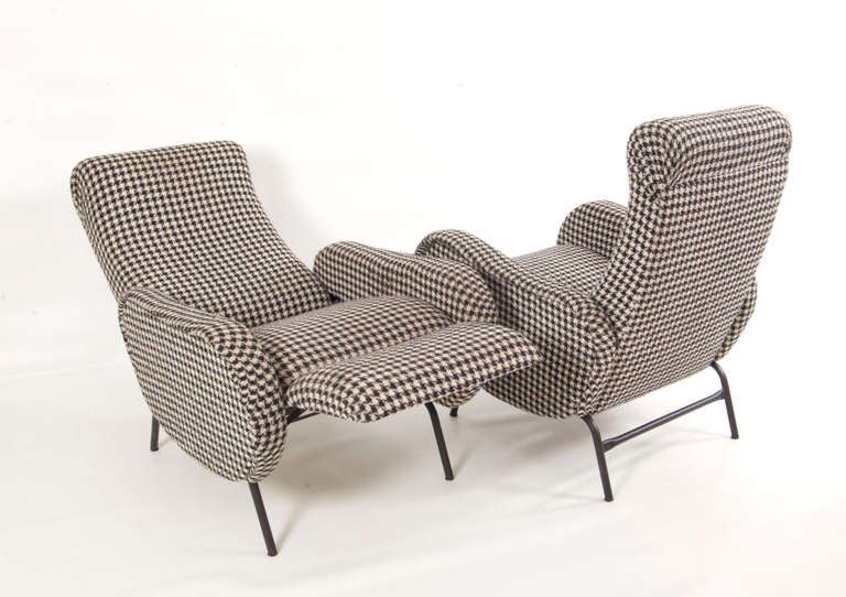 Adjustable back section with foot support and the original upholstery in a houndstooth pattern.