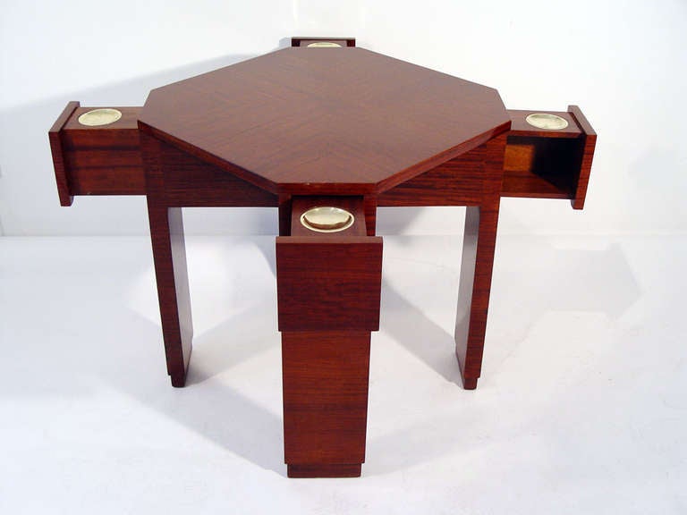 Characteristic Art Deco design by Joubert and Petit of the highest quality. Octagonal polished mahogany card table, four drawers with fitted brass ashtrays.