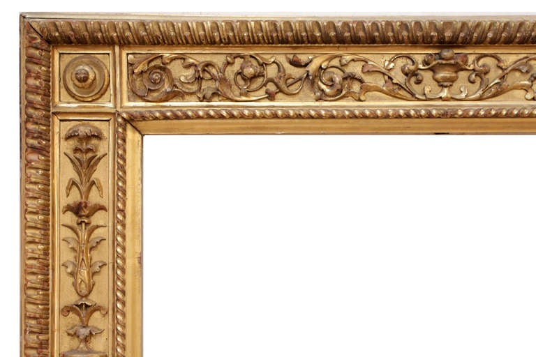 PERIOD FRAME 19th-century Italian painting frame.  Gilded hand-carved wood; punch work frieze with applied neo-classical candelabrum motif ornament and finials at corners. 
Sight size (opening from front): 44-1/2” x 39-1/2” 
Molding width: 6-1/2” 