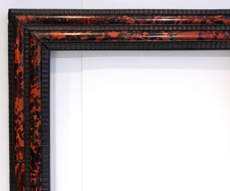 19th century European frame, reverse profile, ebonized wood and inlaid tortoise shell. 
Sight size (opening from front):  24-3/4” x 19-3/8” 
Molding width: 4-1/2” Depth from wall: 2”
Outside: 33-1/2” x 28”

MIRROR may be added (flat, beveled