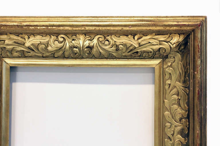 IMPORTANT c. 1910-20 American Arts and Crafts frame, gilded hand-carved wood, wide scoop profile, scrolling foliate brocade pattern. Excellent orginal condition. Brass medallion verso: FOSTER BROTHERS/ MAKERS/ BOSTON, MASS.  
sight size (opening
