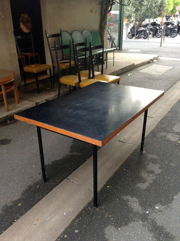 circa 1950 for this table whit black formica top and oak on metal feets base

Dim = 135 x 87 x 74 cm