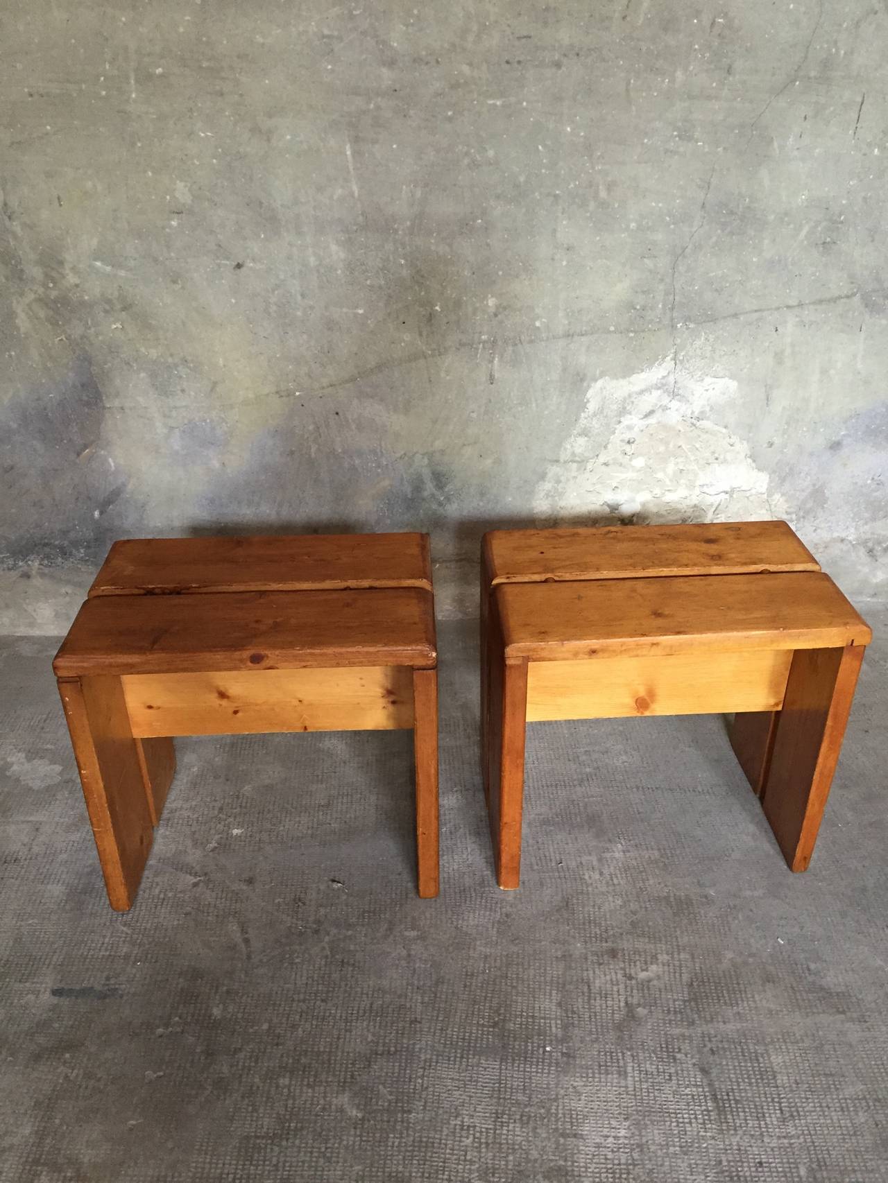 a very good vintage condition for this pair of pinewood stools by Charlotte Perriand for 