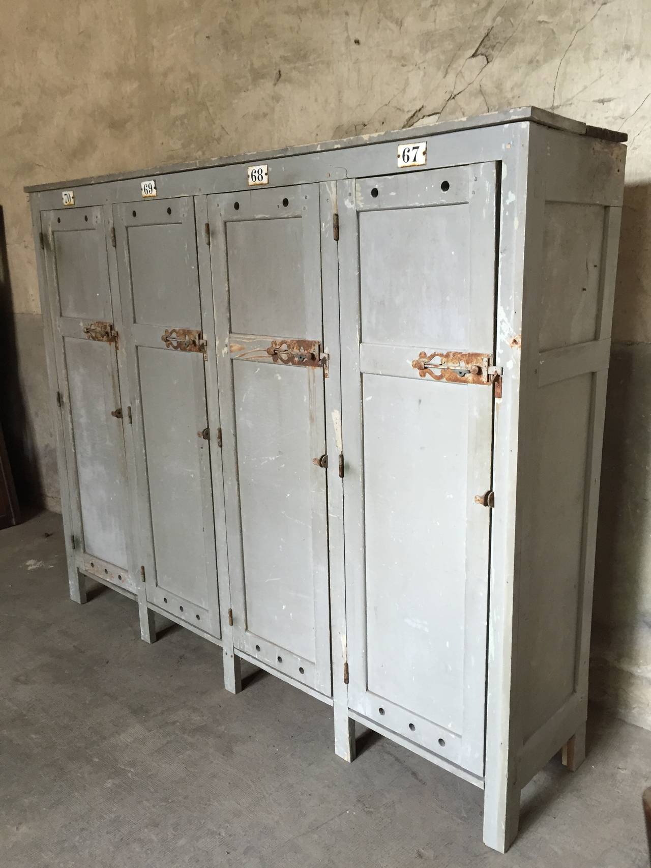 tall and very nice French wood industrial lokers furniture with original painting circa 1900

Dim = 218 X 175 X 45 cm