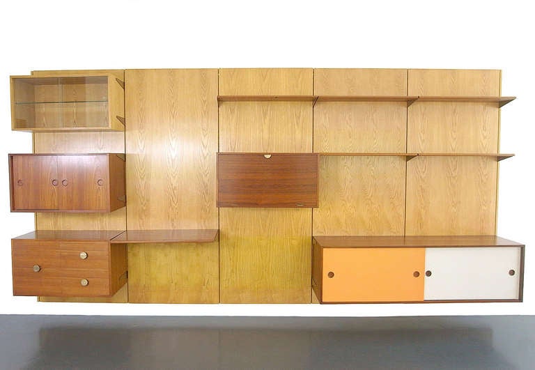 Finn Juhl Panel Wall, Bovirke Denmark, 1953
This wall unit offers a bar, writing desk, with drawers & sideboard, shelving for books, the wall unit is totally ajustable to your requirements