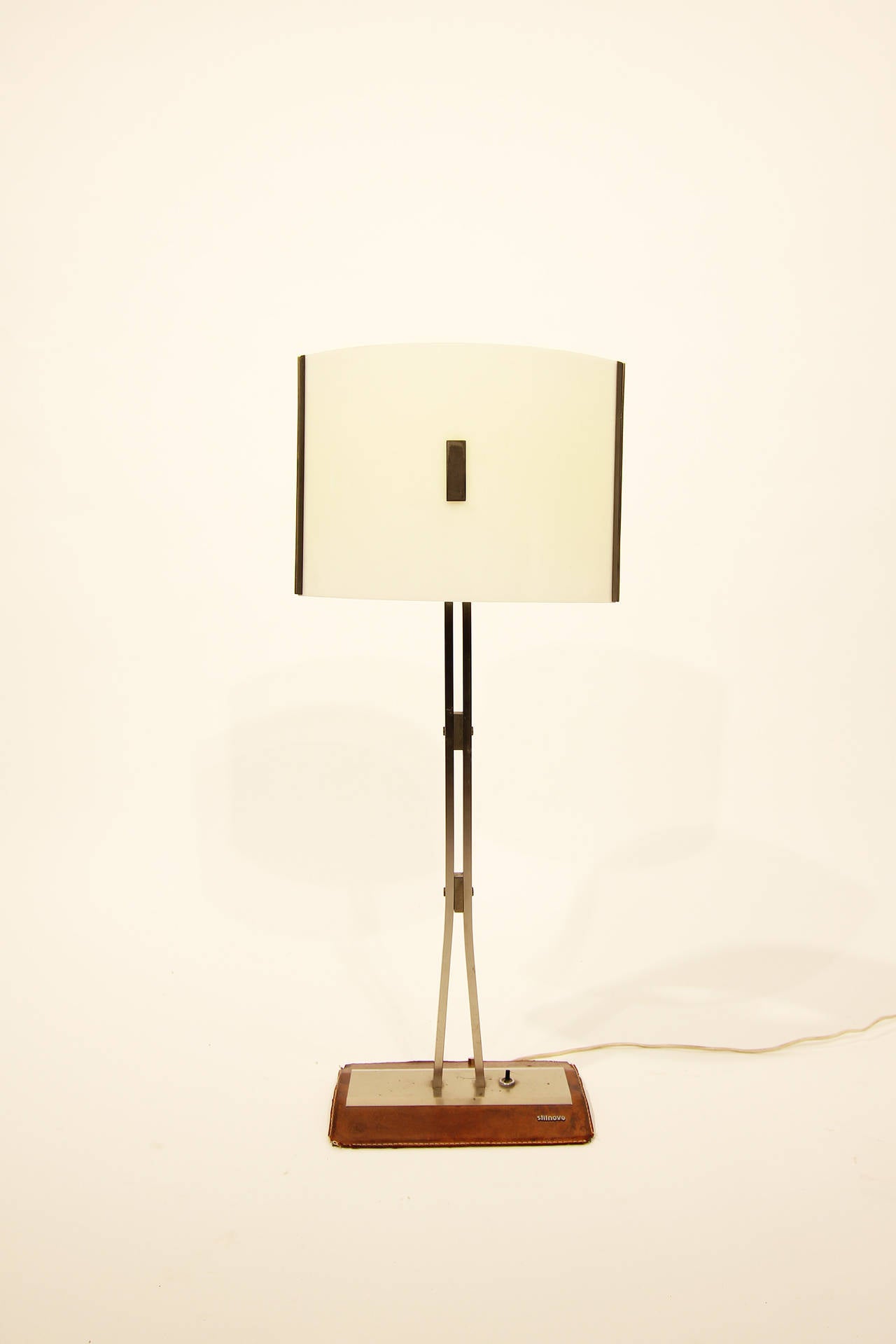 Table Lamp by Stilnovo Italy circa 1958

construction metal, foot covered with leather
acrylic glass white and yellow