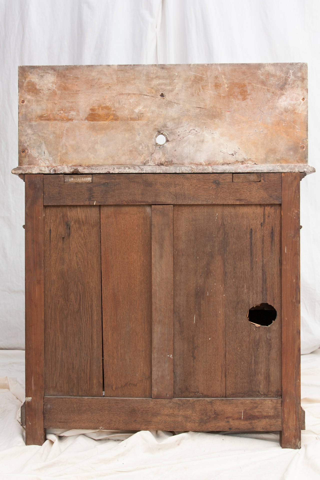 Pine Vanity Cabinet
This heart pine vanity cabinet has a refined yet rustic appeal.  The original marble top features a high backsplash with an upper shelf and a cutout for a wall mount faucet.  The sink features a swiveling lavabo for washing,