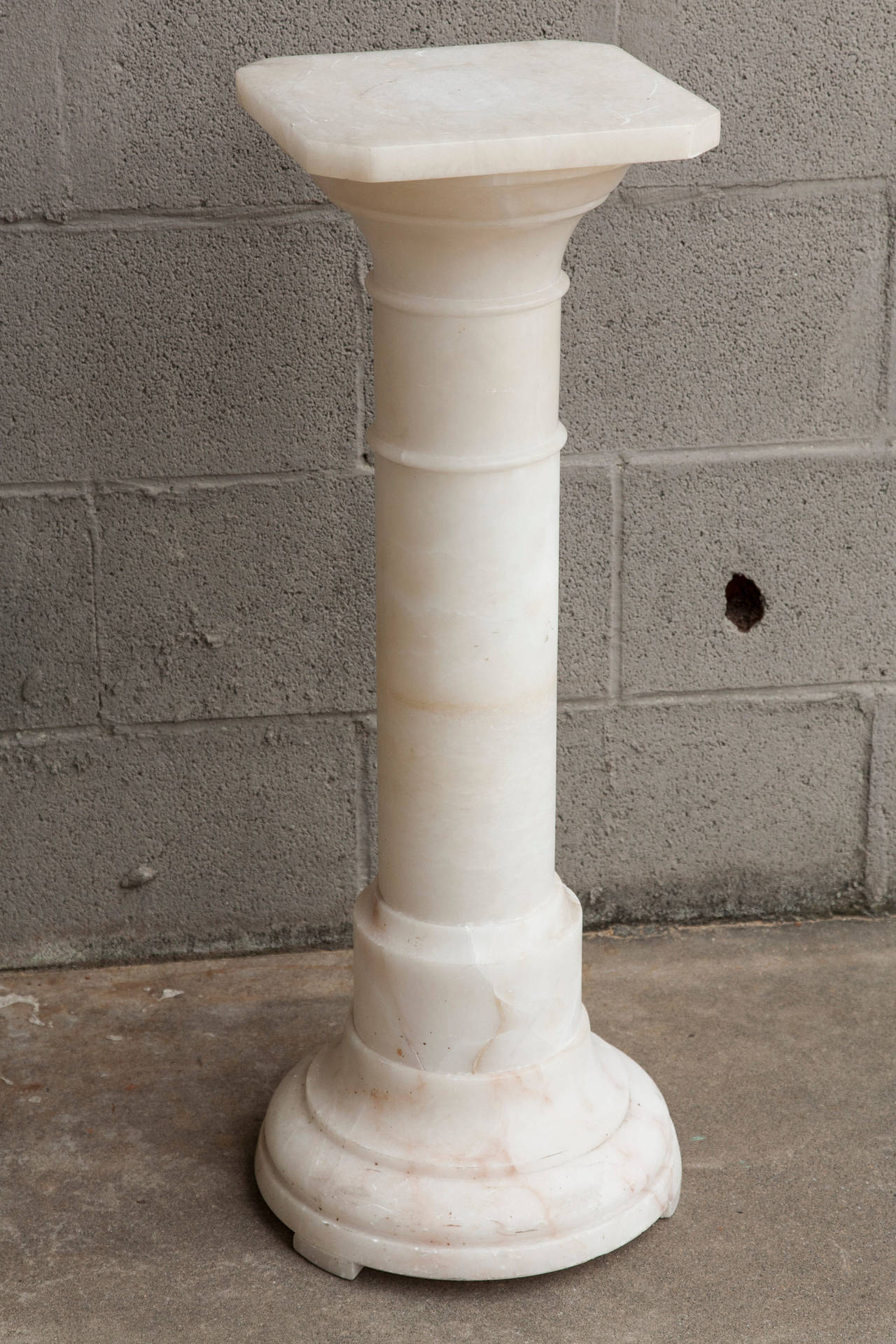 This elegant classical column, made of pure alabaster, will make a beautiful display stand for a sculpture or plant.