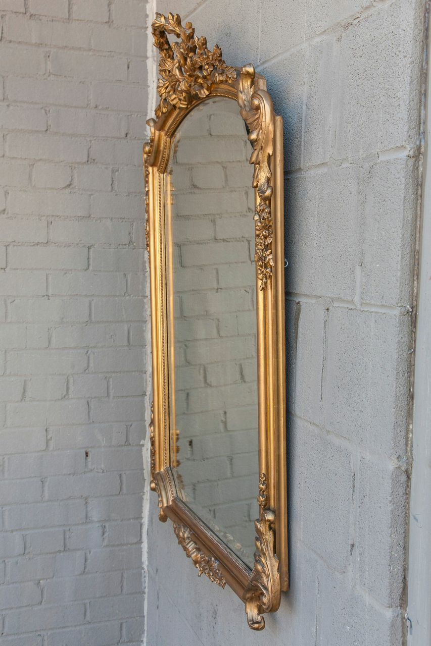 French 19th Century Louis XV Giltwood Mirror with Beveled Glass and Laurel Motif