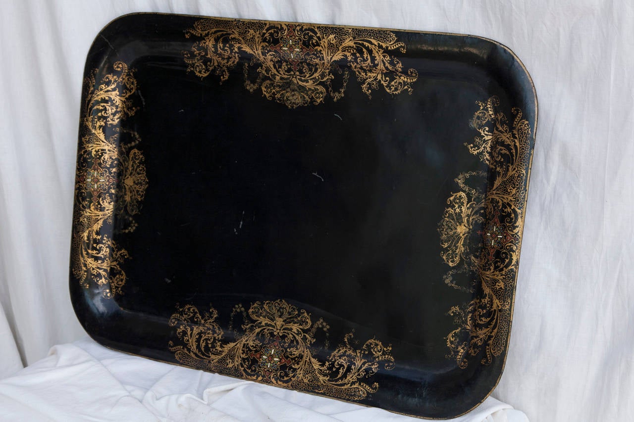 This elegant piece of serveware from Napoleon III's Campaign era in France features a finely painted gold decorative border on its remarkably intact black surface. A fantastic large size for service or display.