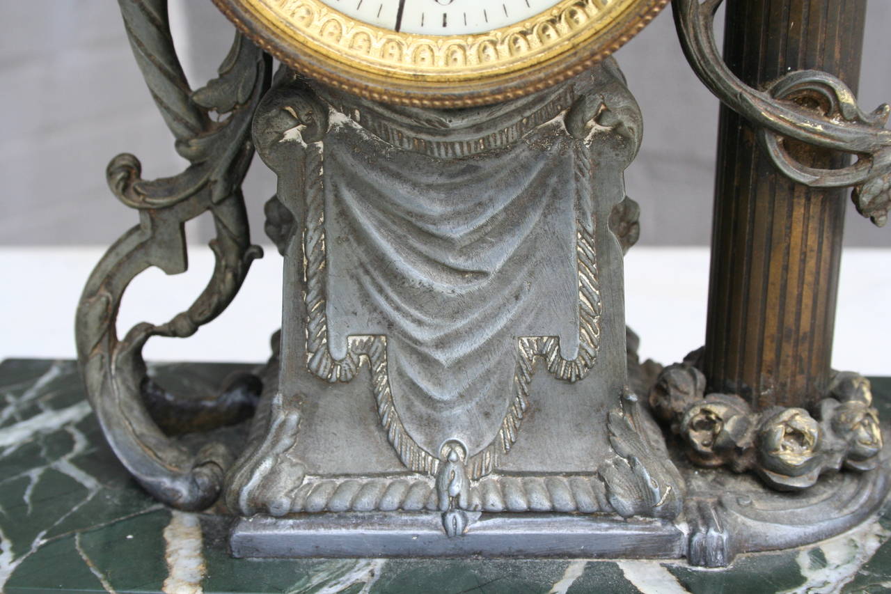 Bronze and Onyx Mantle Clock Featuring Cherub and Bouquet 1