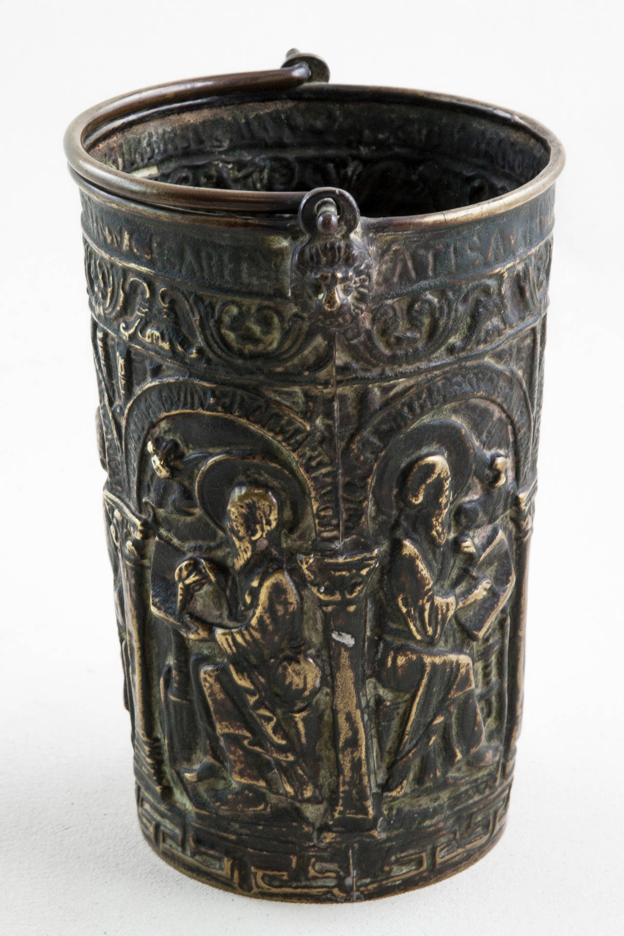 This 17th century Louis XIV period bronze holy water vessel features a Gothic scene featuring monks attending to their monastic duties. A unique historical artifact for collectors, this piece is made of solid bronze which has aged to a deep hue.