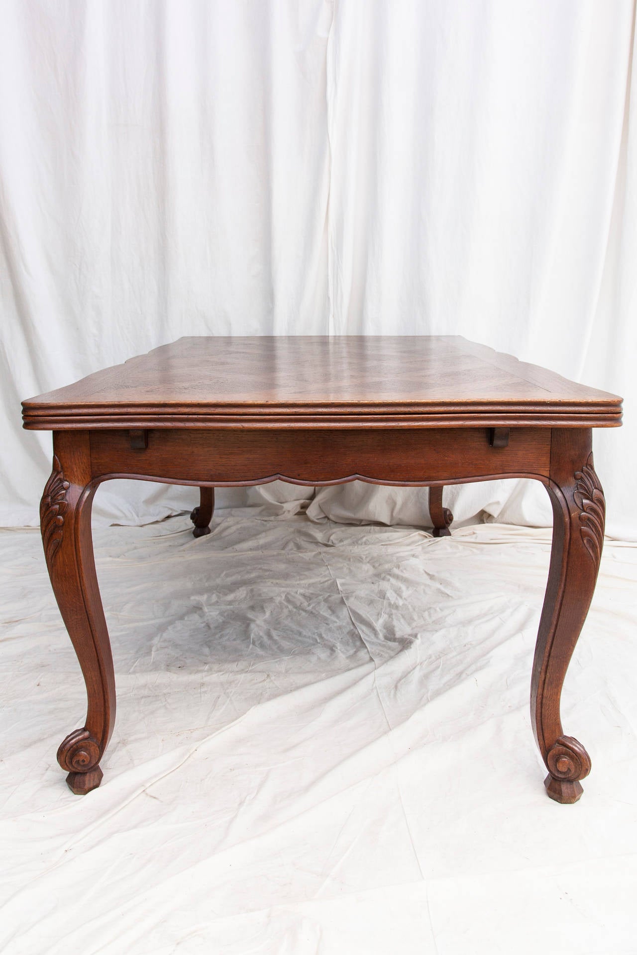 20th Century Hand-Carved French Draw-Leaf Table with Parquet Top and Beveled Edge