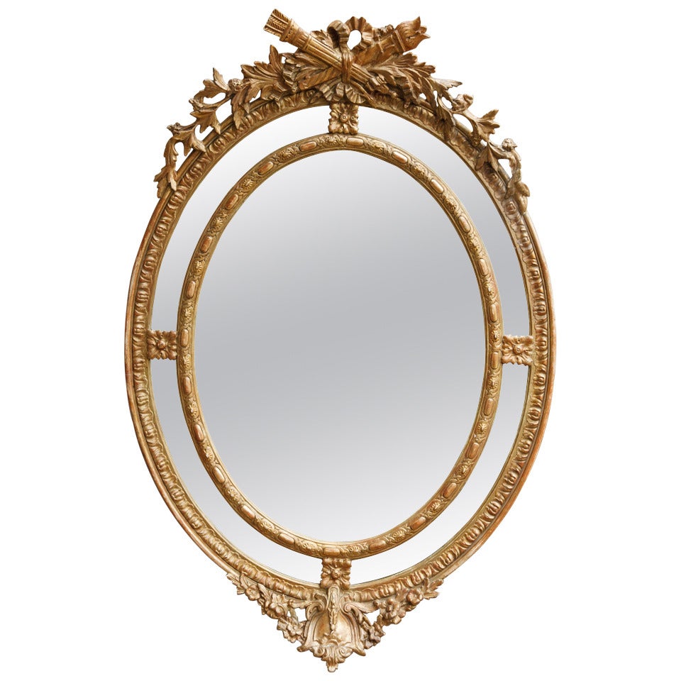 Grand French Napoleon III Period Louis XVI Style Mirror with Ornate Torch and Arrow Carving