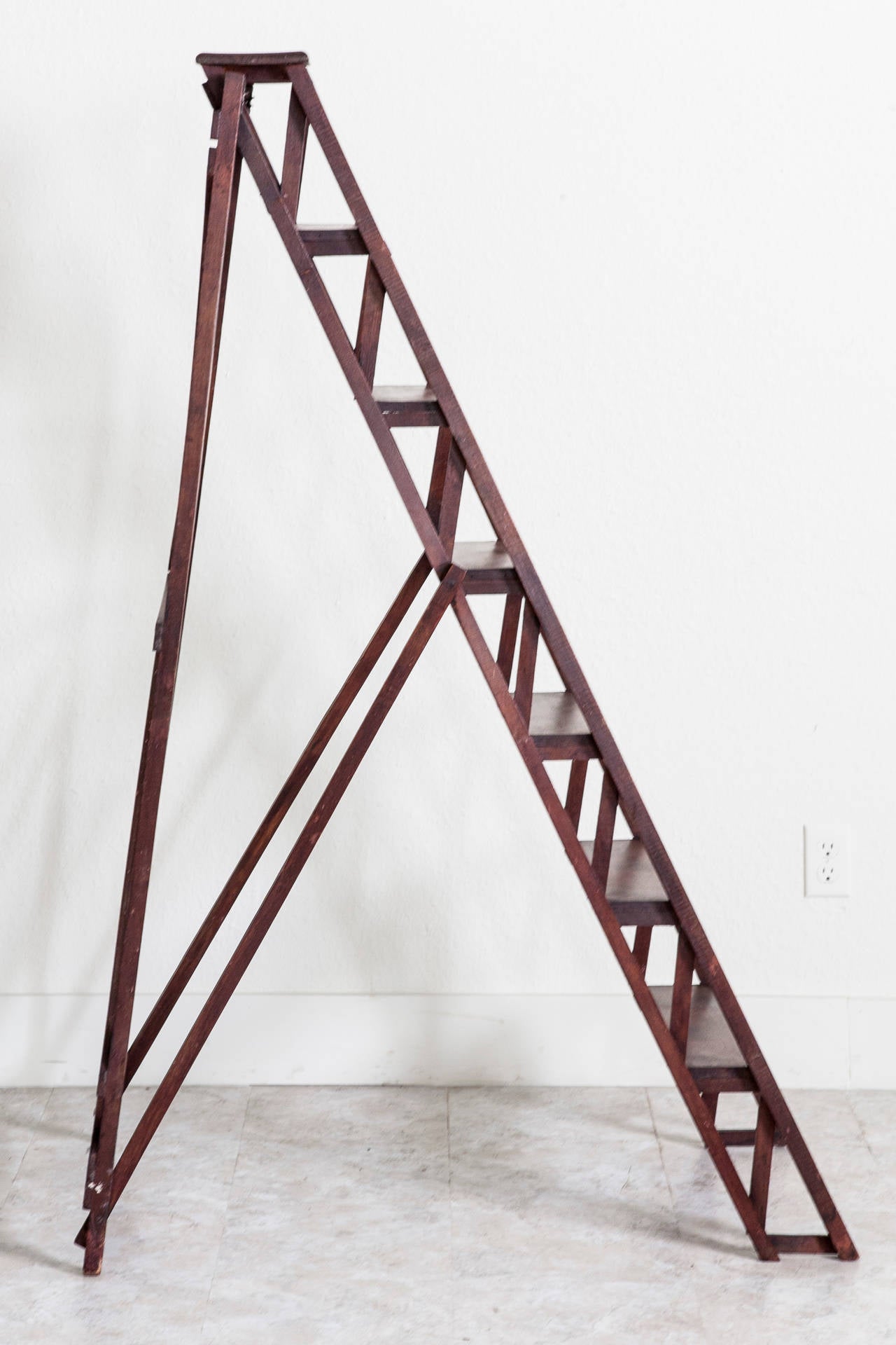 A handsome addition to any space with hard to reach shelving, this artisan made beech wood ladder was originally used in a French library. Although this piece displays beautifully as decor, it remains sturdy enough for daily use as a ladder, and at