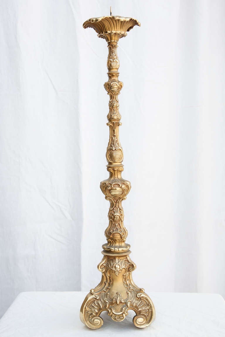 This regal 19th century candlestick in the Louis XIV style is made of solid bronze and was originally used on the altar of a church.  At 34