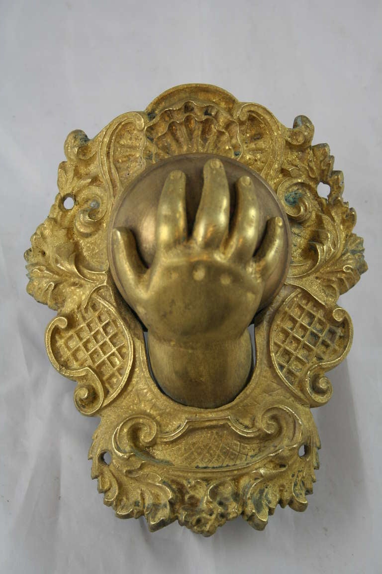 Nineteenth century French gilt bronze billiard table pocket in the shape of a child's hand.  Child's hand drops down upon catching billiard ball.