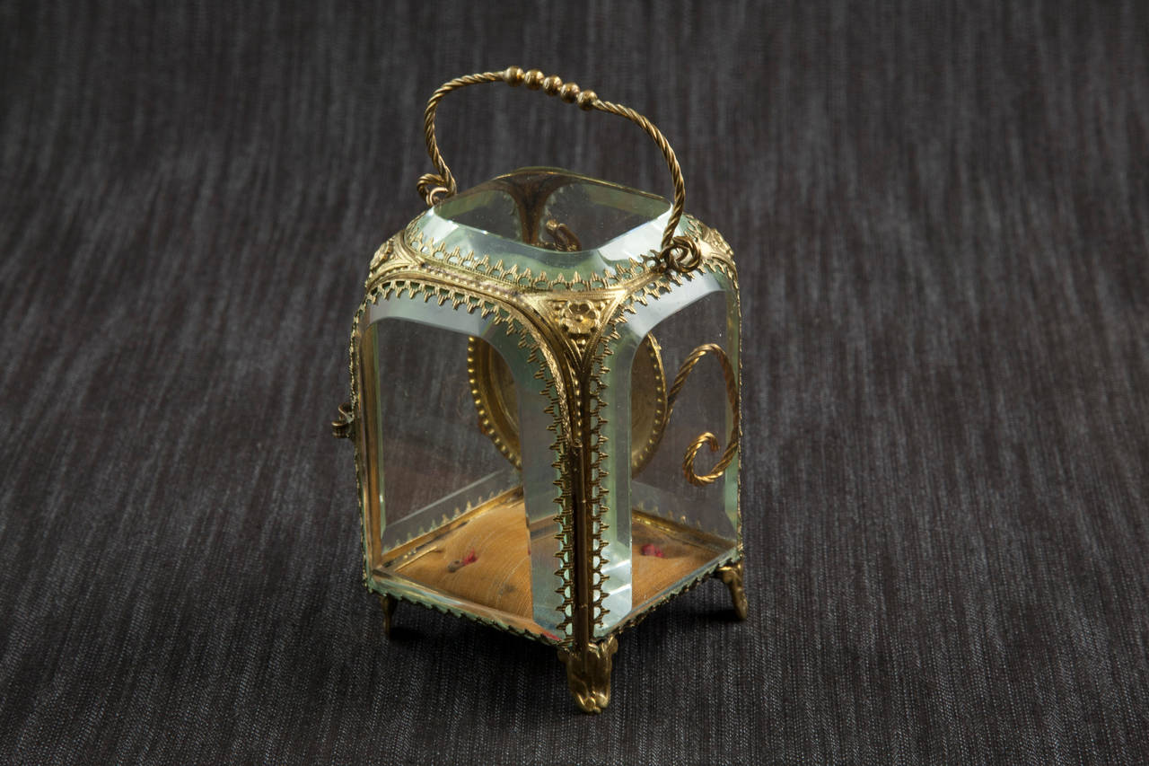 Bronze and beveled glass porte-montre or pocket watch display case, c. 1900.