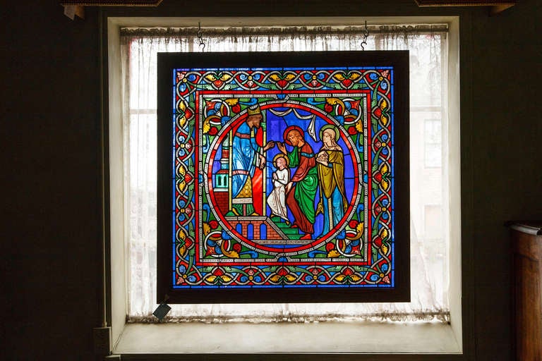 This rare hand painted stained glass window from Chartres, c. 1880, in saturated jewel tones will make statement as either a window or framed piece of art. Made by artisans in the style of 13th century Chartres stained glass, this glass depicts the