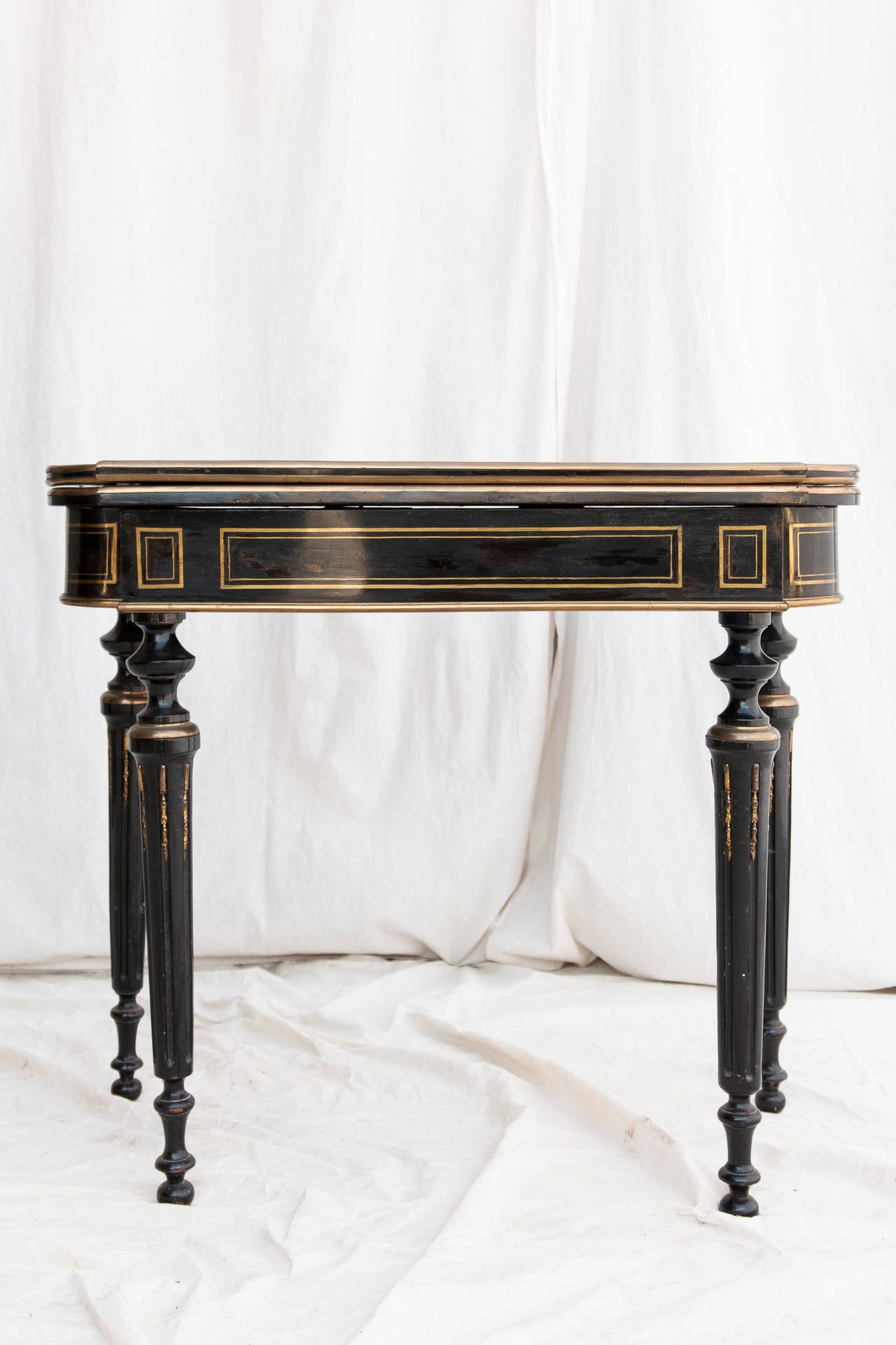 Mid-19th Century Napoleon III Ebonized Console Game Table with Bronze Inlay