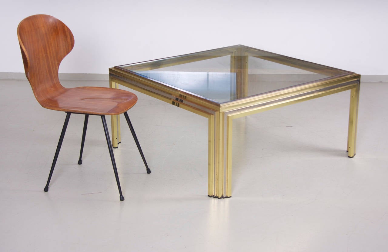 Huge coffee table from Romeo Rega in brass and chrome. Table has a fantastic patina and is a real eye catcher item.