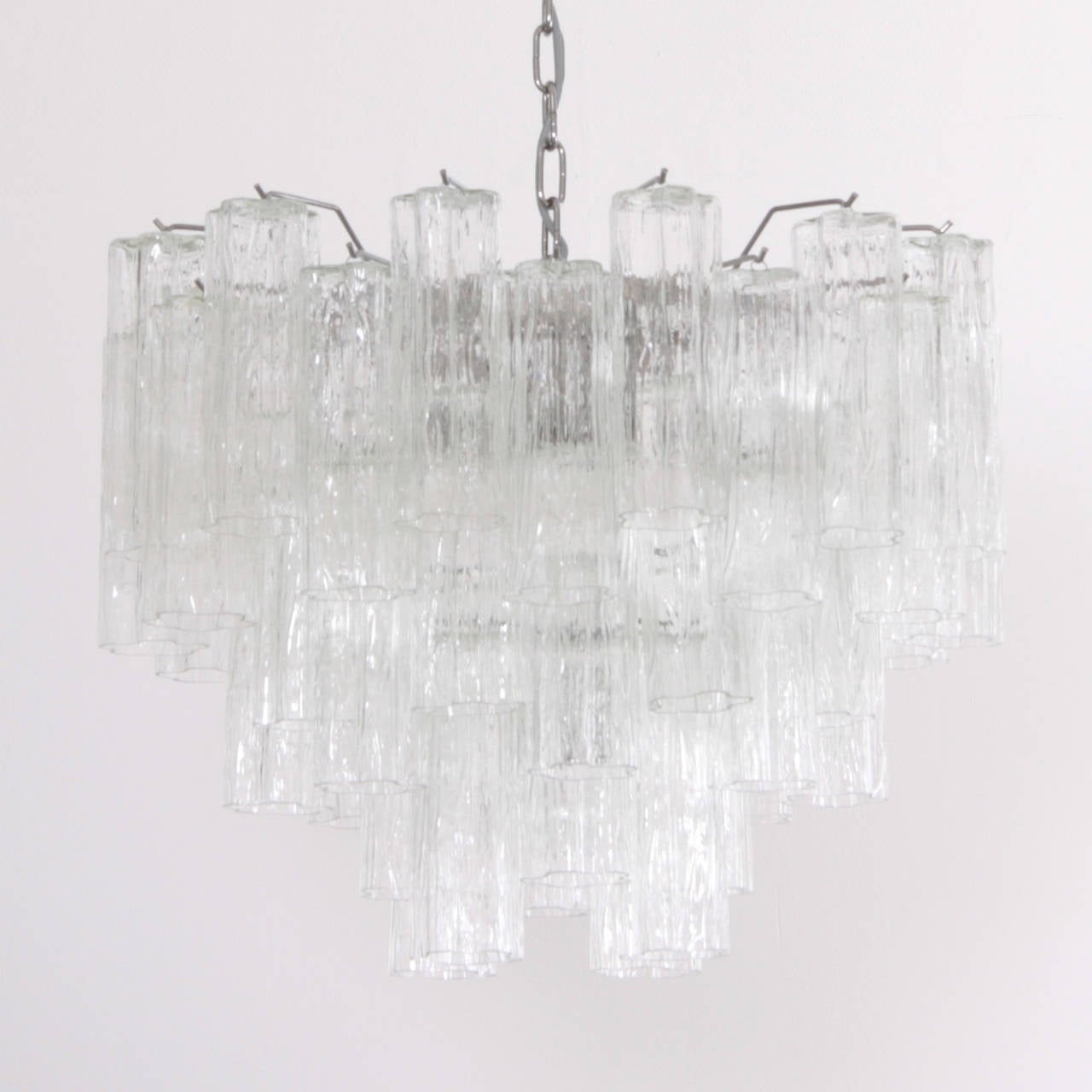 Huge high quality Murano glass chandelier, which brings wonderful lighting atmosphere in every room. The chandelier has multiple tiers of handmade Tronchi glasses fixed on a chrome armature. The chandelier is in excellent condition. A smaller