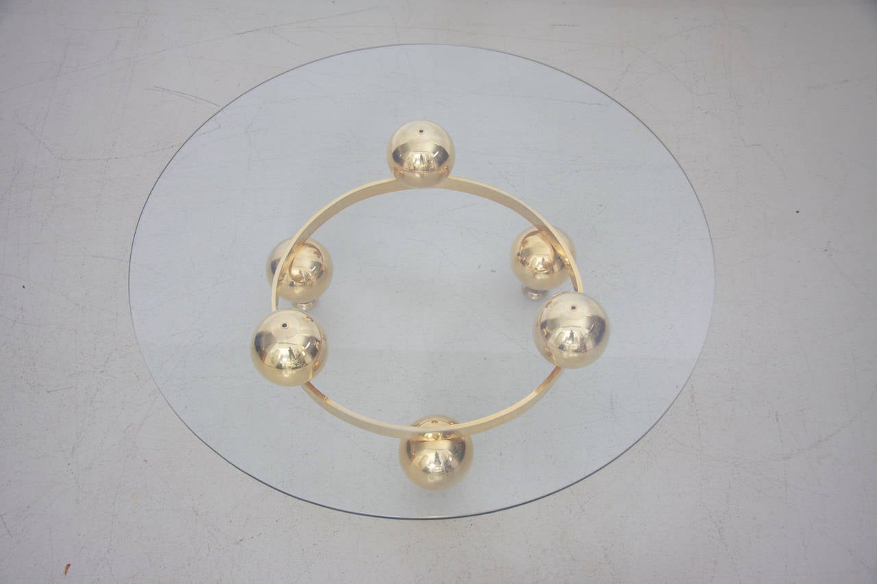 round brass coffee table with glass top