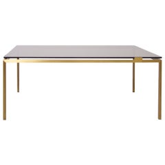 Elegante mesa baja de latón y cristal a la manera de la Maison Jansen