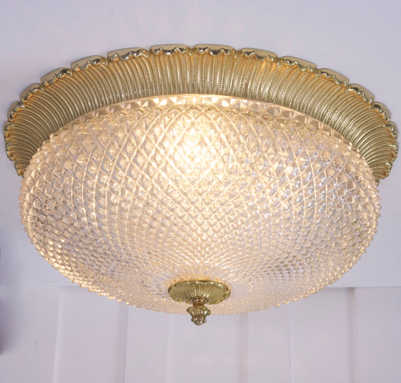 Beautiful and very rare in this huge size. The honeycomb glass flush mount from the 60s has a real gold plated base and head. Fantastic glass quality. Other honeycomb flush mounts are also listed. 4 x E27
To be on the the safe side, the lamp should