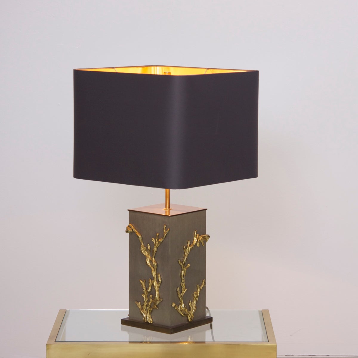 Very rare and elegant Maison Charles table lamp with massive bronze applications of algues or corails. The lamp is signed and has a very nice lamp shade, which is gold on the inside. So the light reflects in gold on the lamp and presents the lamp is