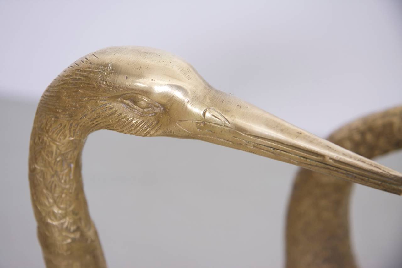 large brass cranes