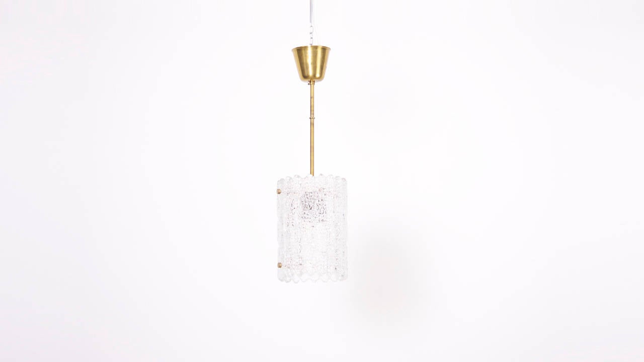 Made out of two pieces of pressed clear glass, that lamp was designed by Carl Fagerlund for Orrefors.
To be on the the safe side, the lamp should be checked locally by a specialist concerning local requirements.


