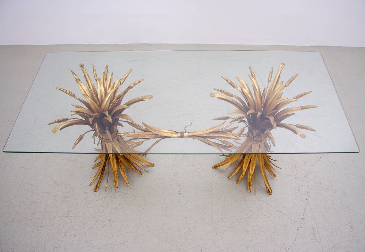 Wonderful gilt metal coffee table in the form of two sheaf's of wheat. Such kind of table was used by Coco Chanel in her wonderful apartment. This Coco Chanel table is special compared to others listed tables, because this is the very rare two feet
