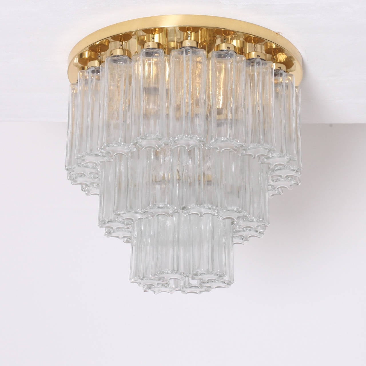 Rare 3-tier flush mount or chandelier with handblown glass pieces on a brass base. This lamp is a high quality production of the 1960s from Glashütte Limburg. 3 2-tier flush mounts from the same series and fitting wall lamps are also listed. The