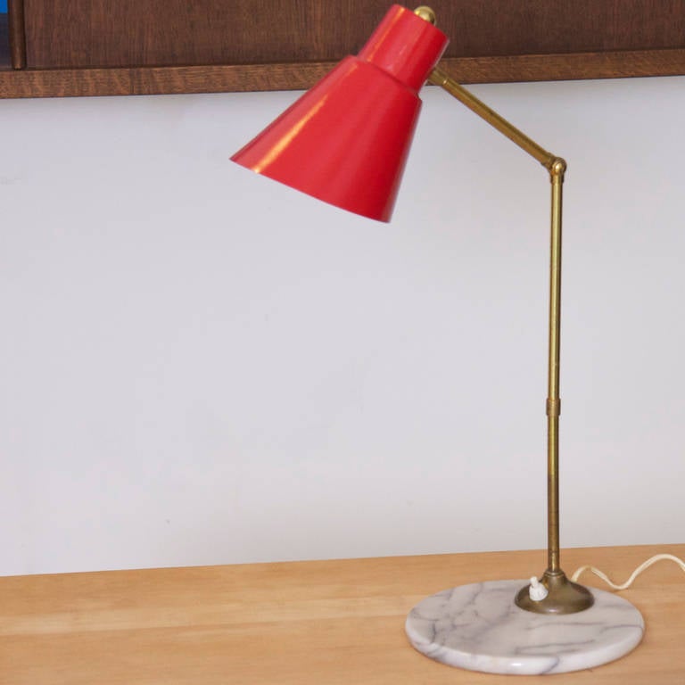 Italian 1950s Articulated Table Lamp attributed to Stilux.
Brass arm, red metal shade and marble base. In excellent condition.

1 x E27 socket.

Please note: Lamp should be fitted professionally in accordance to local requirements.